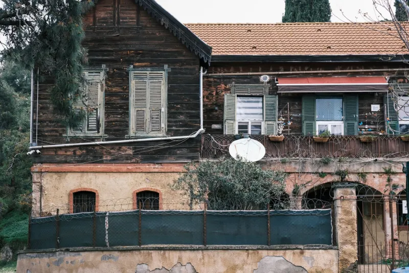 When Steel Meets Stucco: The Hidden Dangers of Retrofitting Industrial Elements onto Traditional American Homes